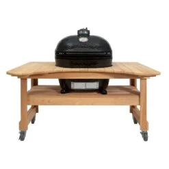 Primo CXLH-600 Extra Large Oval Ceramic Charcoal Kamado Grill On Curved Cypress Table